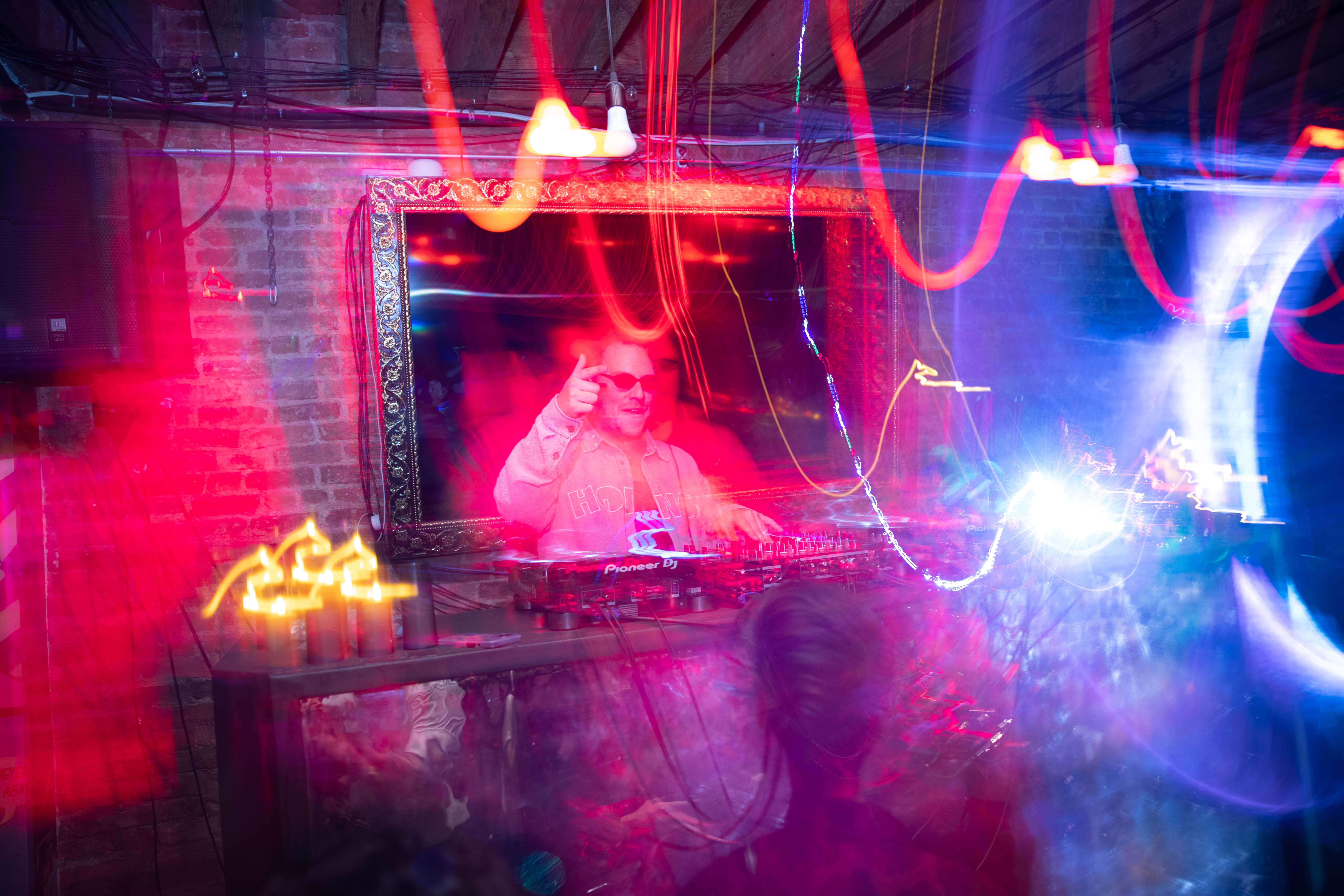 Denver event DJ performing with colorful lighting at Colorado private event