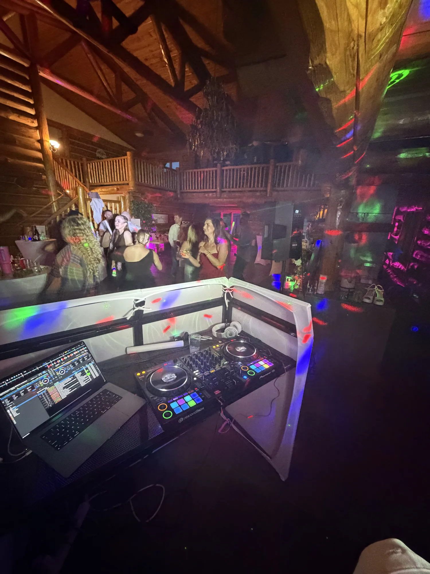 Josh DJing a foggy wedding after-party at a mountain house