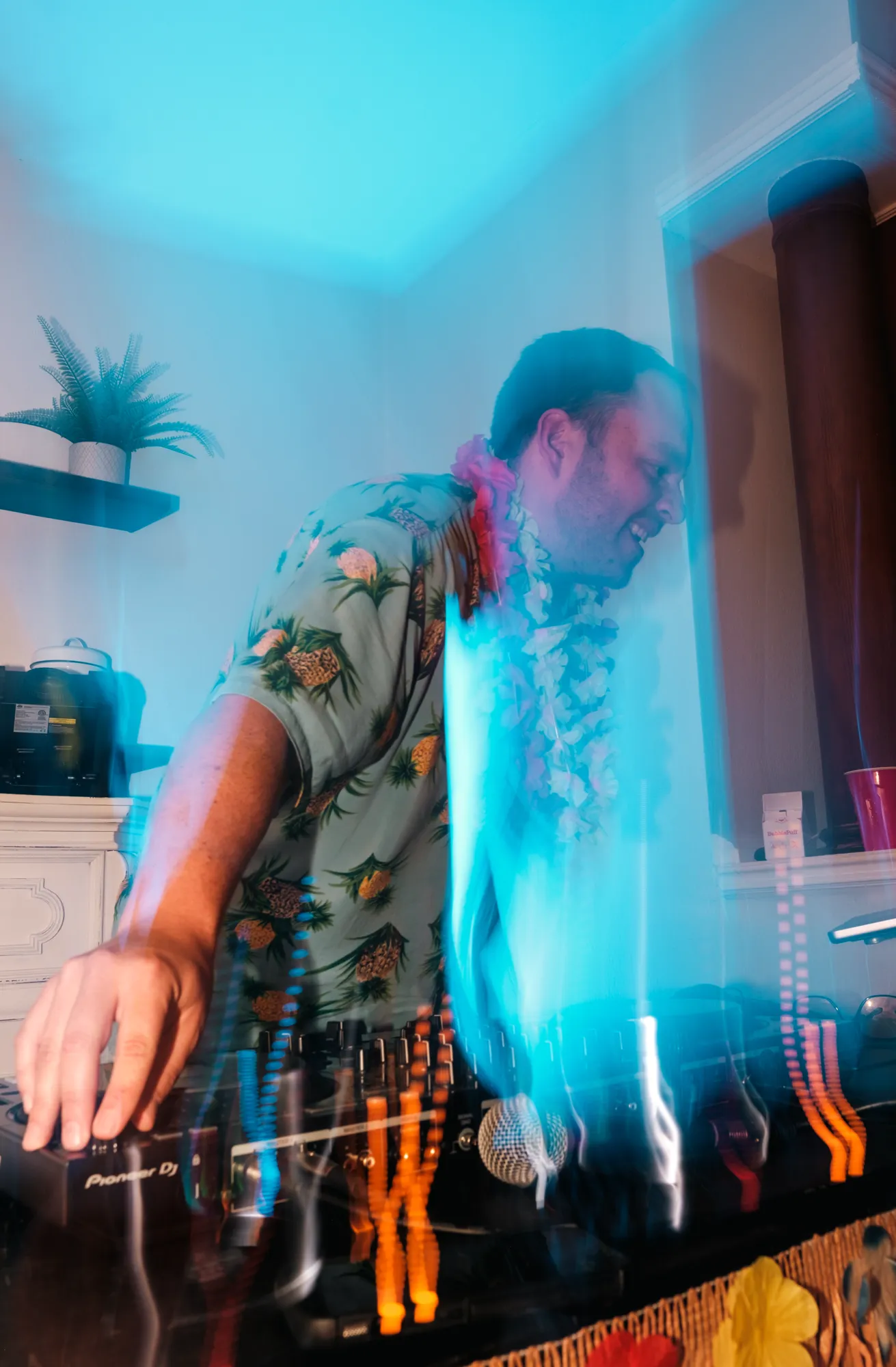 Josh DJing a Hawaiian-themed birthday house party